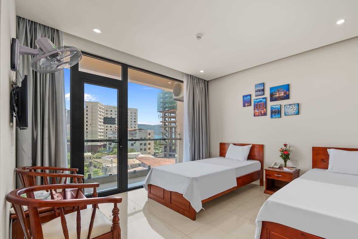 Deluxe Twin Room, Multiple Beds, City View | Premium bedding, down comforters, memory foam beds, minibar