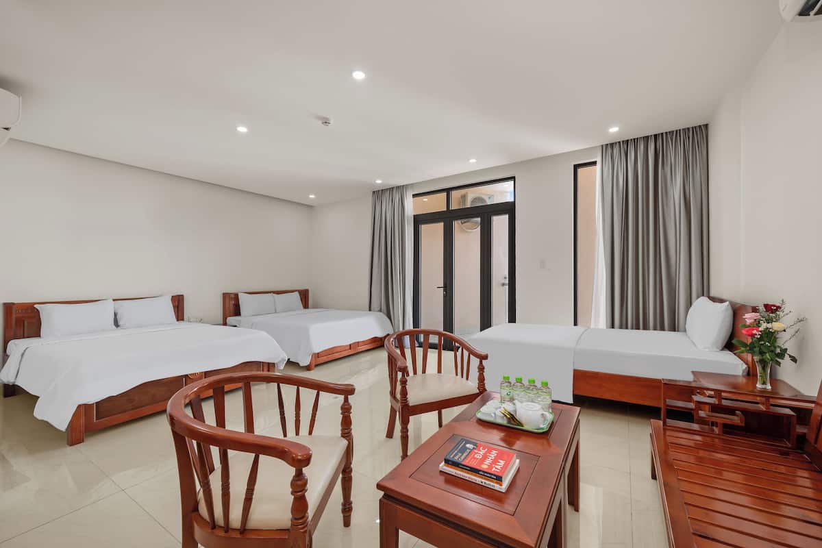 Family Quadruple Room, 2 Queen Beds, City View | Living area | 50-inch LCD TV with satellite channels, printers