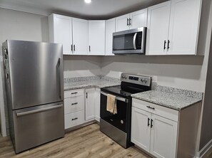 Fridge, microwave, coffee/tea maker, dining tables