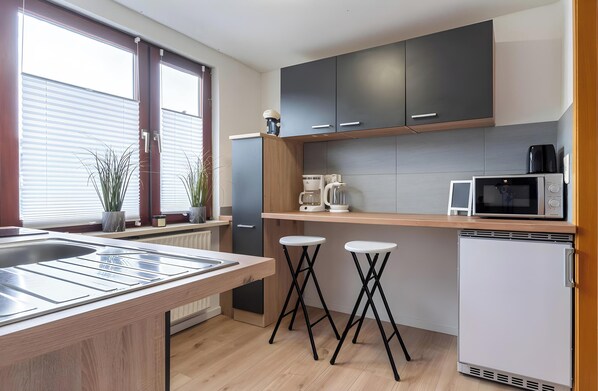 Fridge, microwave, stovetop, coffee/tea maker