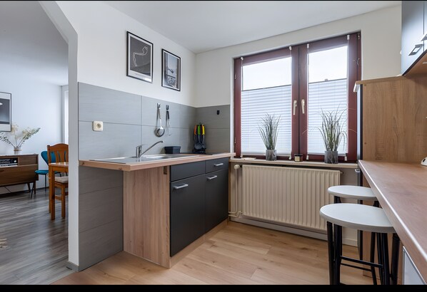 Fridge, microwave, stovetop, coffee/tea maker