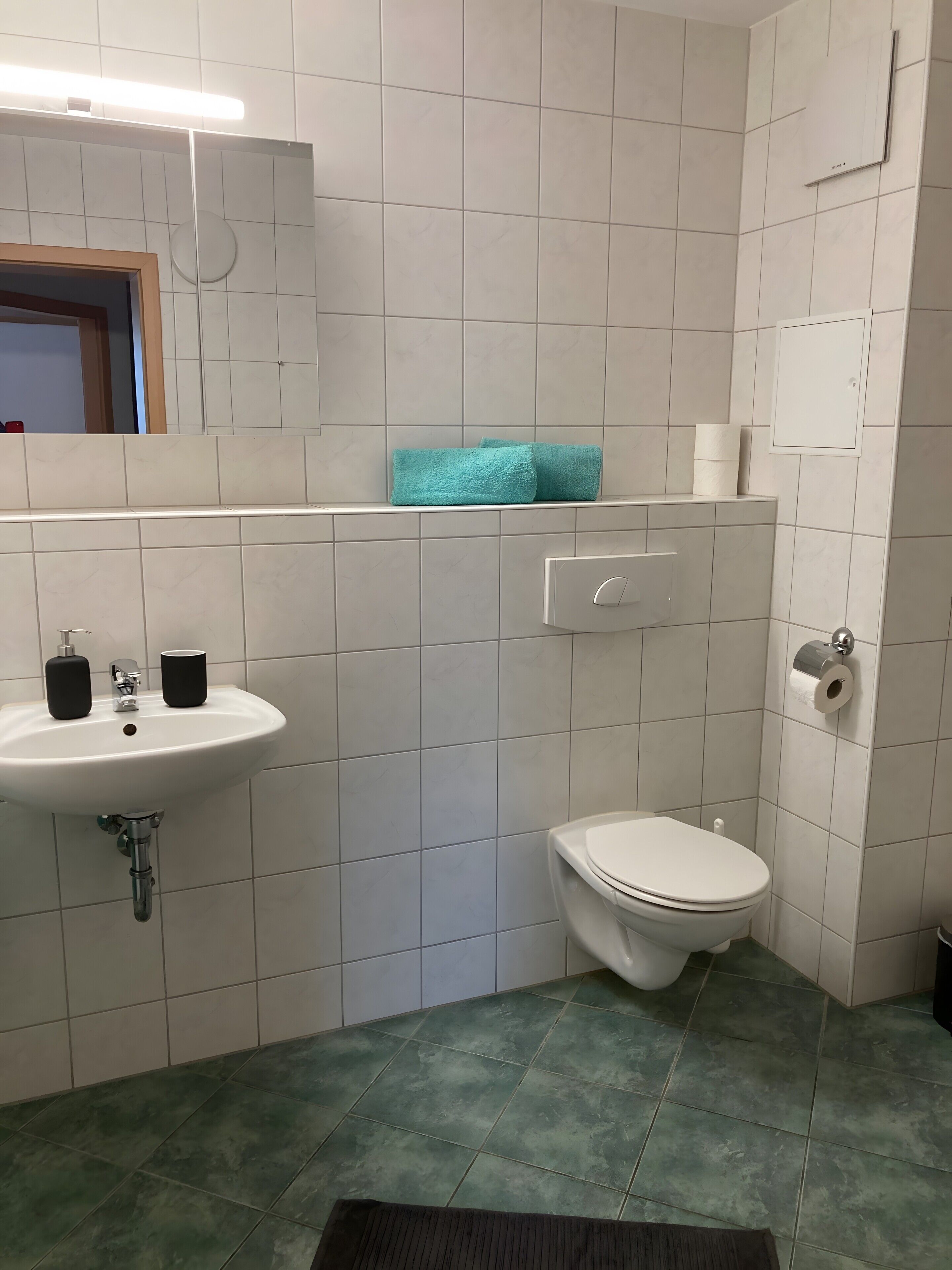 Een douche, handdoeken