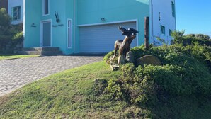 A two-story house with a garage, a mailbox, and a mailbox number 32. - Peaceful escape in the coast of Paradise beach, Jeffreys Bay, South Africa (Jeffreys Bay)