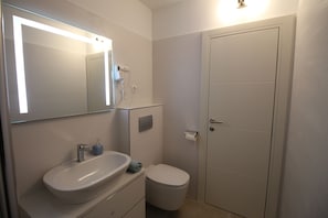 Hair dryer, towels, soap, toilet paper