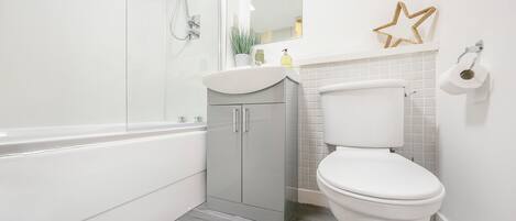 Shower, towels, soap, toilet paper