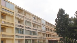 A multi-story building with balconies, large windows, and a flat facade. - Cozy apartment near the Thermal Baths in Balaruc-les-Bains (Balaruc-les-Bains)