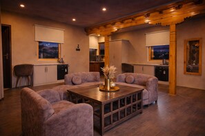 Serenity Bathtub Suite with Balcony | Living area | 43-inch Smart TV with satellite channels - The Vintage Villas Resort Ladakh - Luxury Stay with Mountain Views (Leh)