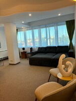 Deluxe Apartment, City View | Living area | 101-cm Smart TV with cable channels