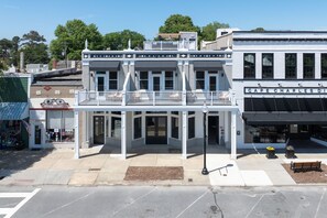 Stunning two-story building with a balcony offering a view of the street below.