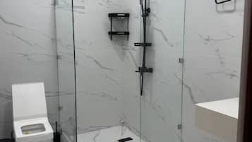 Shower, hair dryer, slippers, towels