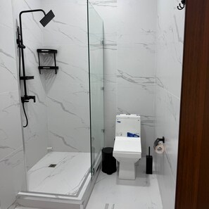 Shower, hair dryer, slippers, towels