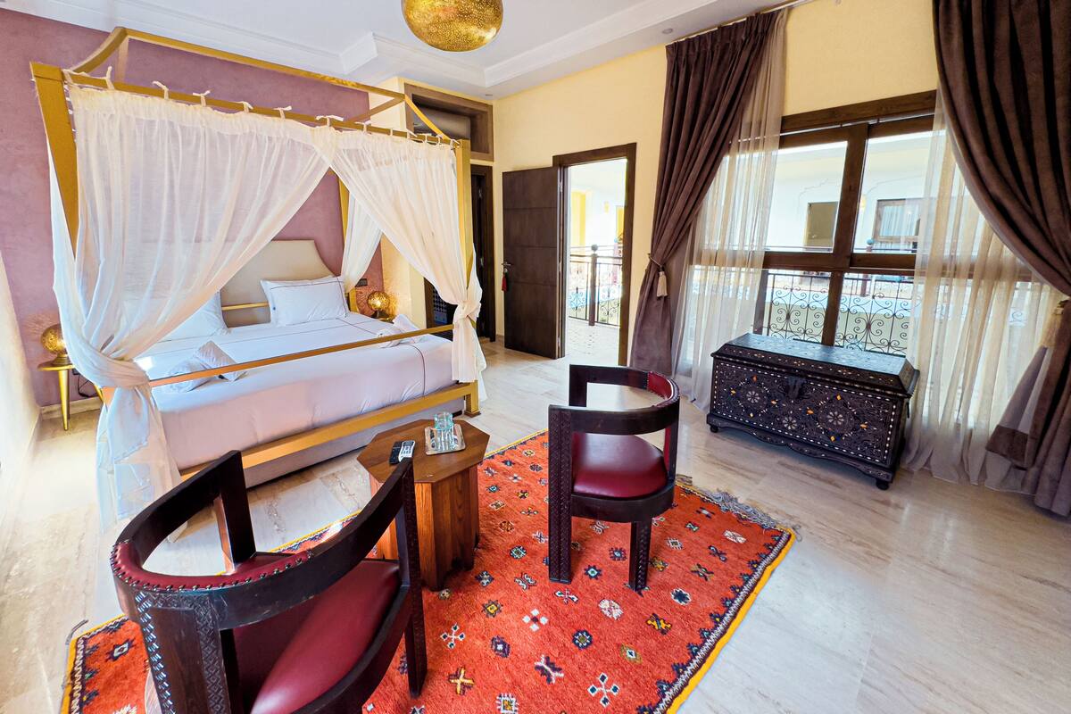 Luxury Suite, Courtyard View | In-room safe, iron/ironing board, free WiFi