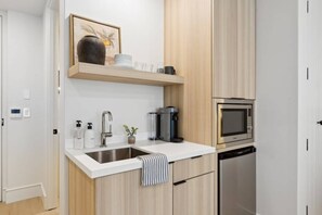 Fridge, microwave, coffee/tea maker, high chair