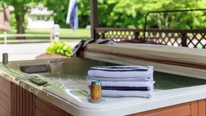 A hot tub with towels and a can of soda on the edge. - 2 Mi to Dtwn: Spacious Gatlinburg Home w/ Hot Tub! (Gatlinburg)