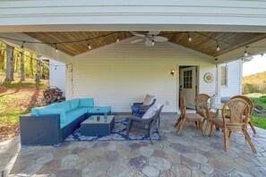 A covered patio with outdoor furniture, a ceiling fan, and string lights. - Dog-friendly! Near Cooperstown, Hiking & Golfing (Cherry Valley)