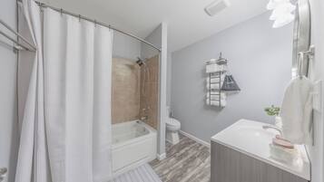 Jetted tub, hair dryer, towels, soap