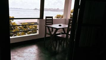 Triple Room, Balcony, Sea View | Individually decorated, individually furnished, desk, laptop workspace