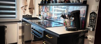 Movie-themed apartment with large screen