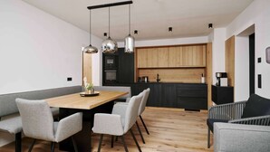 A modern kitchen with wooden cabinets, a central island, and a dining area with grey upholstered chairs and a wooden table. - Apartment in Berwang With Ski-in/ski-out (Berwang)