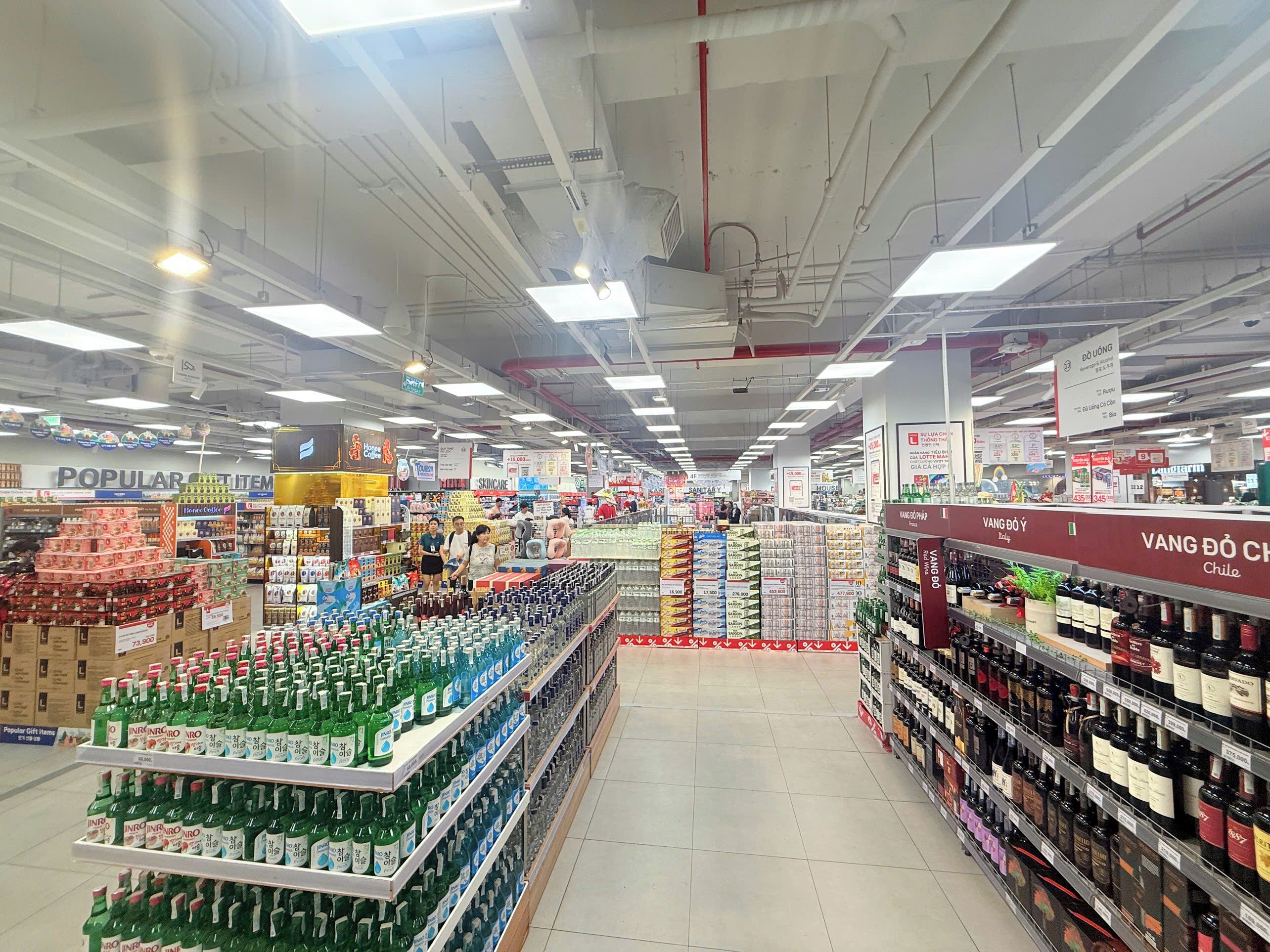A supermarket aisle with various products and signs.