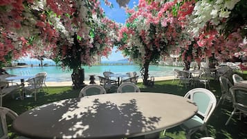 Outdoor pool, open 7:00 AM to 6:00 PM, pool umbrellas