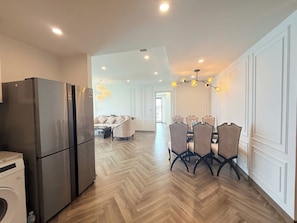 Exclusive Apartment, 3 Bedrooms, Balcony, Beach View | Living area | 65-inch flat-screen TV with digital channels