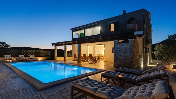 A modern house with a swimming pool, outdoor seating, and a patio area. - **Villa Admiral: Your Idyllic Retreat in rural area of Trogir hinterland** (Blizna Gornja)