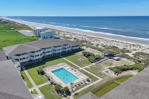 Exterior - Oceanview Bliss: Walk to Everything from this Cheerful Beachfront Condo (Oak Island)
