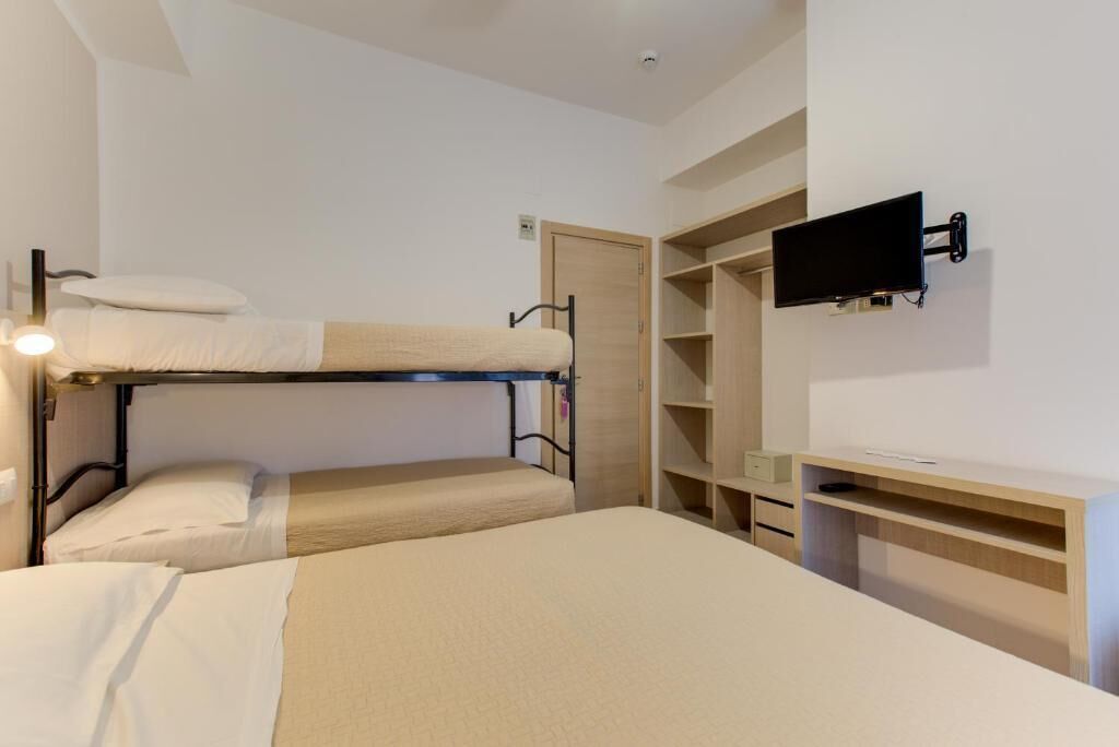 Economy Quadruple Room, Balcony | Bathroom | Shower, hair dryer, towels, soap