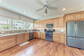 Fridge, stovetop, dishwasher, coffee/tea maker