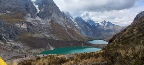A mountainous landscape with a lake and rocky terrain.