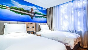 A hotel room with two beds, a large mural of a landscape, and a view of a body of water through sheer curtains. - Qiuguo Hotel Beijing by Bayluxury (Beijing)