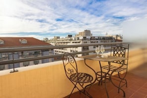 Enjoy a drink on the balcony with a view of the surrounding buildings.