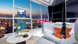 A high-rise hotel room with a city view, a marble table, and modern furnishings. - Fraya High - altitude Future Hotel (Chongqing)