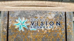 A sign for Hotel Vision Budapest with a star logo and the hotel's name. - Hotel Vision Budapest by Continental Group (Budapest)