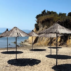 Private beach, white sand, sun loungers, beach umbrellas