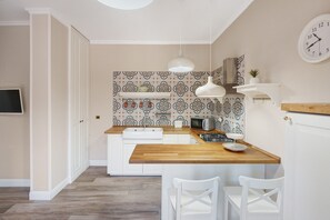 Fridge, microwave, stovetop, cookware/dishes/utensils