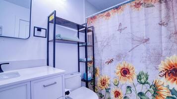 Shower, towels, soap, toilet paper