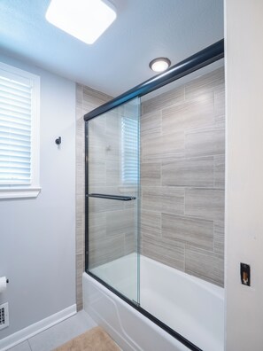 Shower, hair dryer, towels, soap