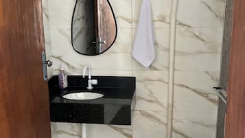 Shower, towels, soap, toilet paper