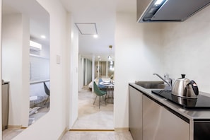 Room 302, non-smoking | Private kitchen | Full-size fridge, microwave, stovetop, rice cooker