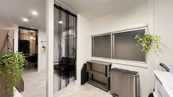 Room 301, non-smoking | Private kitchen | Full-size fridge, microwave, stovetop, rice cooker