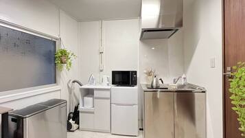 Room 301, non-smoking | Private kitchen | Full-size fridge, microwave, stovetop, rice cooker