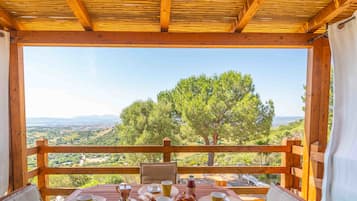 Enjoy a peaceful meal with a scenic view from this dining area.