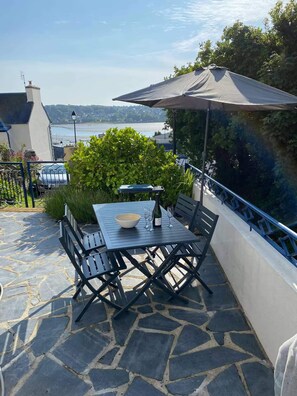 Enjoy a romantic meal for two on this scenic patio overlooking the water.