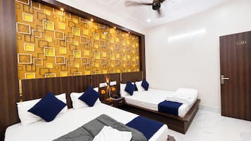 Deluxe Quadruple Room, City View | In-room safe, soundproofing, free WiFi, bed sheets
