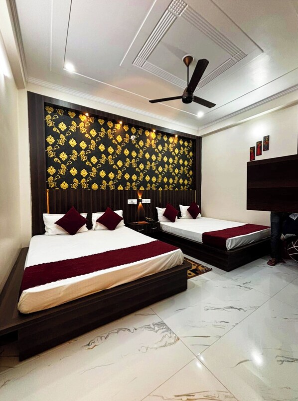 Deluxe Quadruple Room, City View | In-room safe, soundproofing, free WiFi, bed sheets