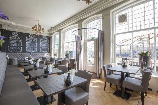 Choose a cozy table by tall windows with street views.