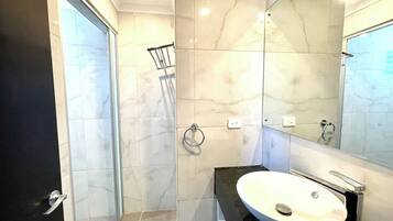 Shower, towels, soap, toilet paper