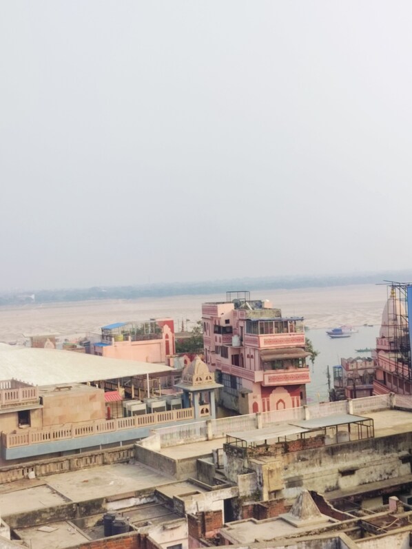 A view of a riverside town with buildings along the riverbank.